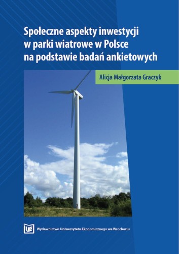 Granatowa okładka, biały tytuł u góry, poniżej wiatrak produkujący prąd stojący pośród zieleni łąki.