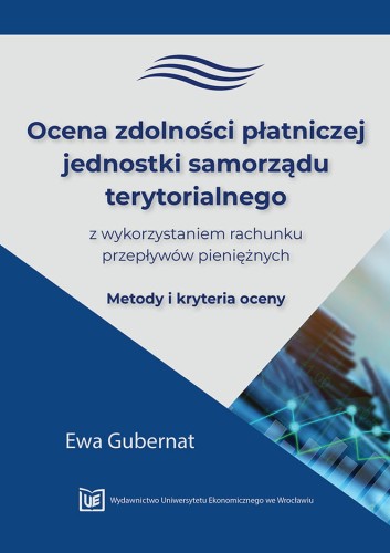 Okładka w odcieniach granatu i szarości, u góry tytuł poniżej maty trójkąt z wykresami liniowymi i słupkowymi. Na dole logo wydawnictwa.