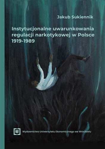 Okładka w odcieniach czerni i ciemnej zieleni, u góry tytuł poniżej spadający w otchłań człowiek.